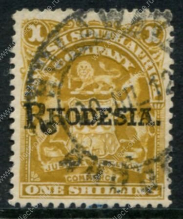 Родезия 1909-1912 гг. • Gb# 107 • 1 sh • герб колонии • надпечатка • "Rhodesia" • серо-лиловая • стандарт • Used VF ( кат.- £ 15 )