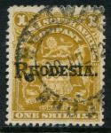 Родезия 1909-1912 гг. • Gb# 107 • 1 sh • герб колонии • надпечатка • "Rhodesia" • серо-лиловая • стандарт • Used VF ( кат.- £ 15 )